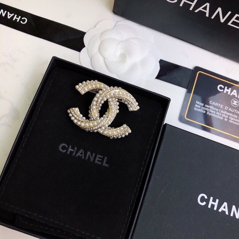 Ch**el brooches